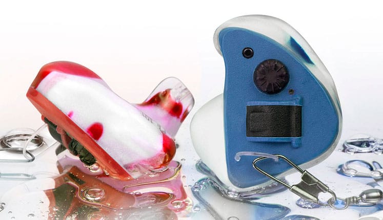 A pair of waterproof custom electronic ear plugs.