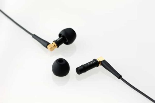 A pair of Final Audio - F4100 - Stereo Earphones on a white surface.