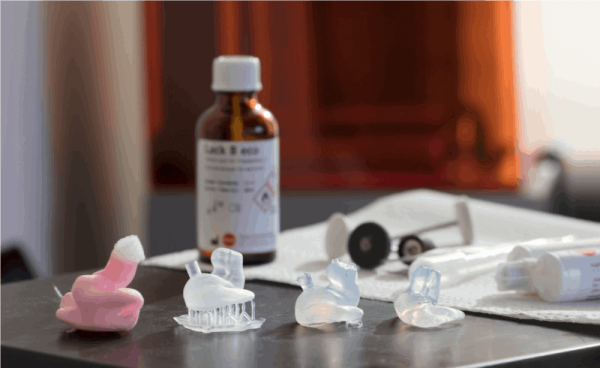 A table with the various stages of construction of Chameleon Ears™ PRO - DECf Musician's Earplugs