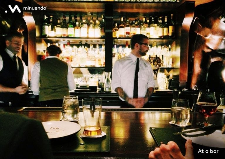 A group of people at a bar.