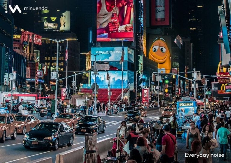 A busy city at night, an example of everyday noise.