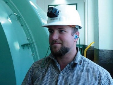 Man in hardhat with hearing protection