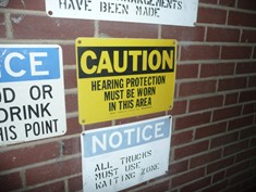 Caution signs including: CAUTION Hearing protection must be worn in this area